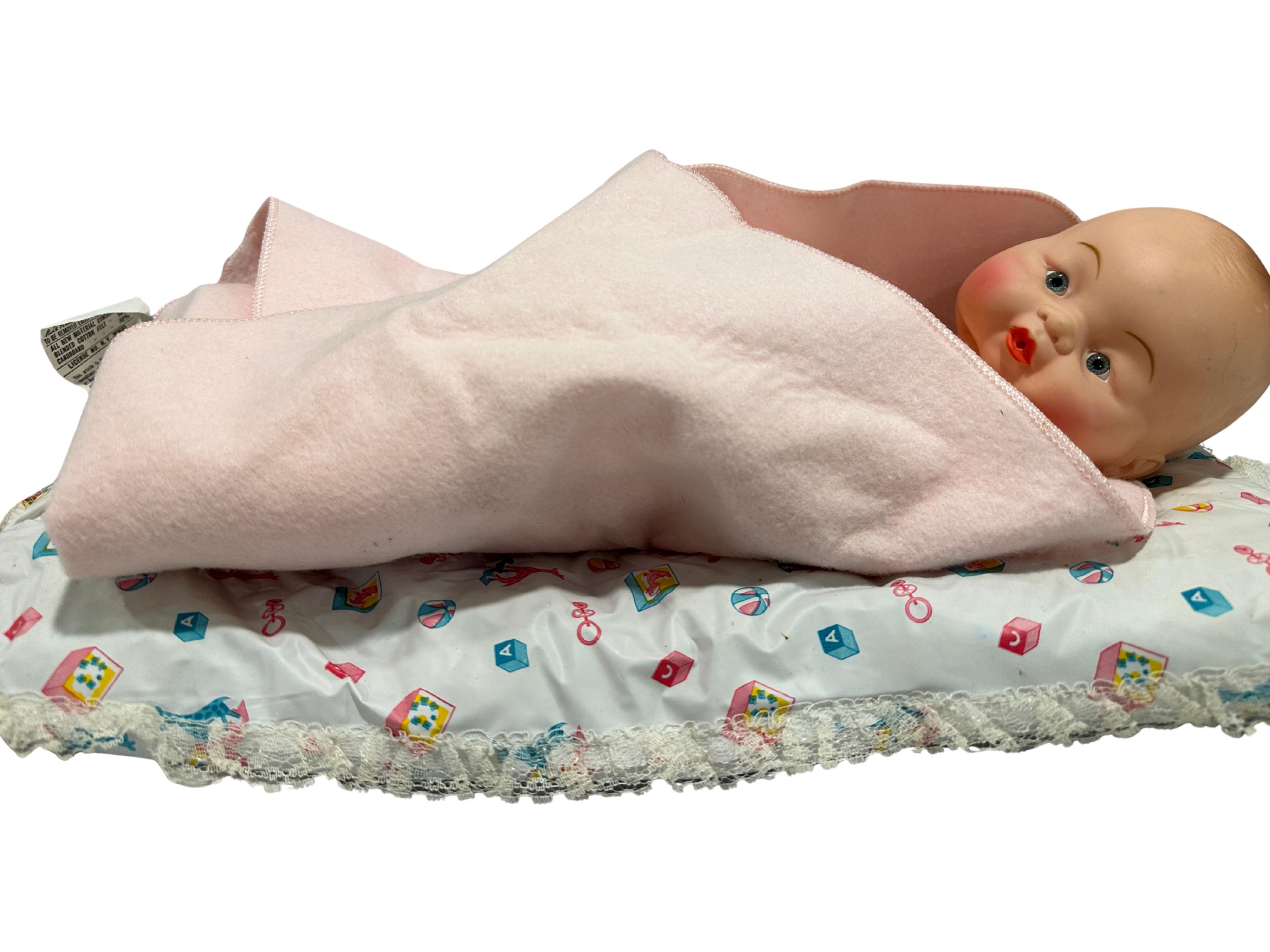 1961 plated moulds baby doll with swaddle and pillow, mid-century display
